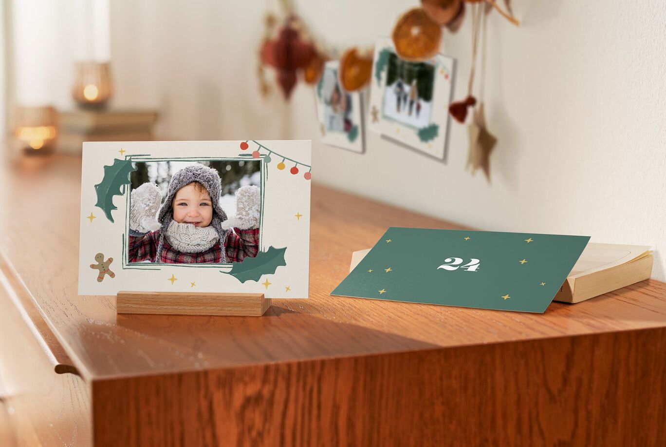 A festively decorated table with a lovingly designed greeting card and a framed photo on a wooden stand, perfect for personal Christmas.