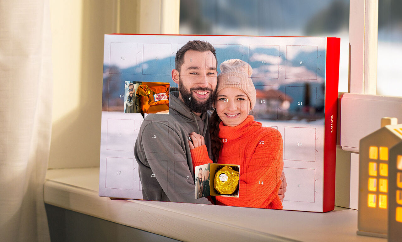 Advent calendar in front of a window with a winter view.